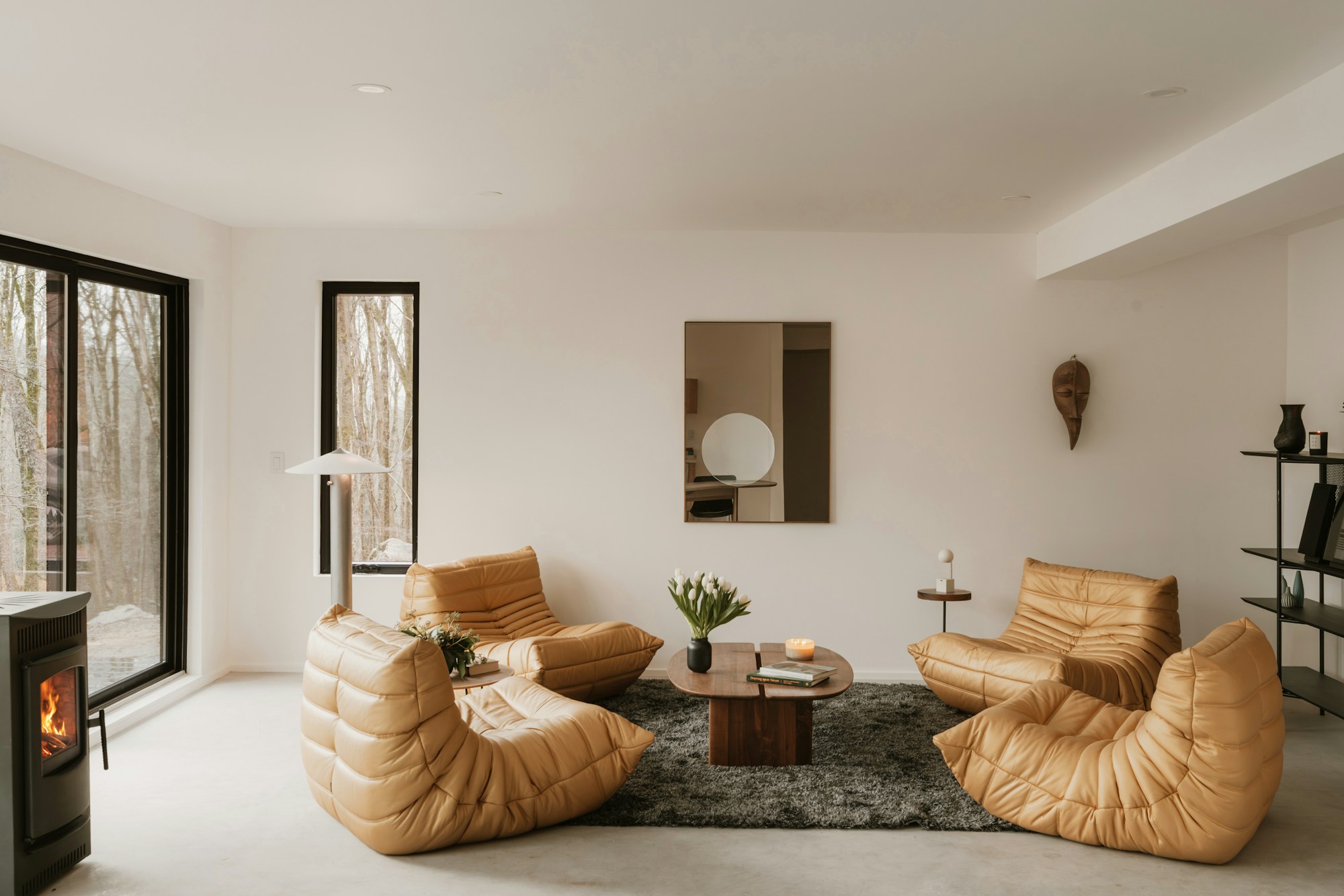 Warm contemporary living room with natural textures and soft daylight